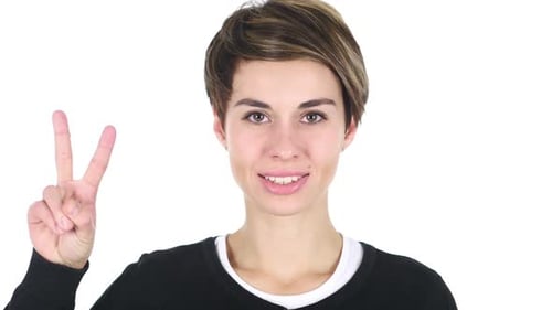 Smiling Woman Makes Peace Sign Close Up