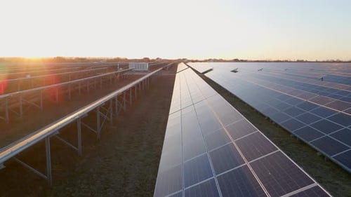 Close Up Drone View of Solar Panels Stand in a Row in the Fields Power Ecology Innovation Nature