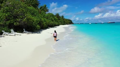 Single lady tans on marine coastline beach holiday by turquoise sea with clean sandy background of t