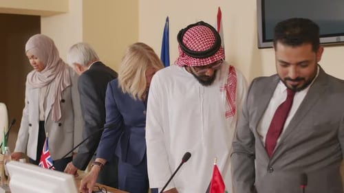 Adults at a Meeting at a Long Table