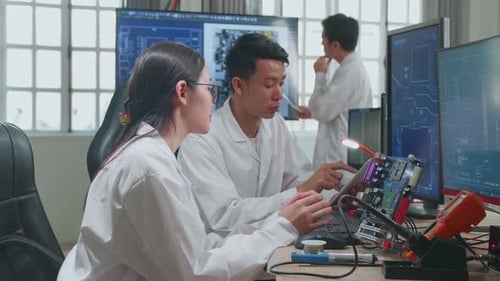 Engineers Collaborating on Computer Hardware Development