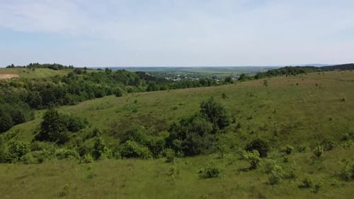 Aerial drone view of a flying over the rural agricultural landscape.