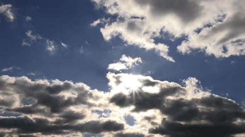 Clouds Moving Across a Blue Sunny Sky