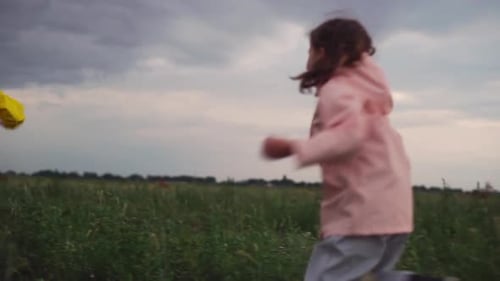 Two Kids Boy and Girl Enjoying Running on Nature Having Fun in Cold Season Slow Motion