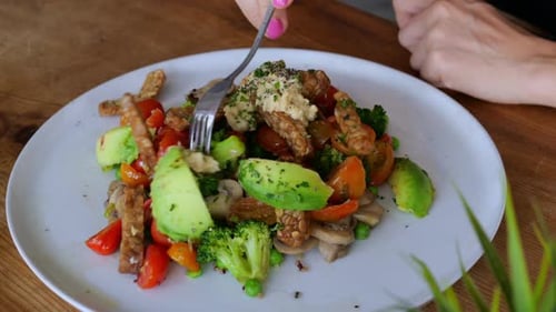 On a White Plate Top View There is a Portion of Fresh Salad of Vegetables Mushrooms Meat