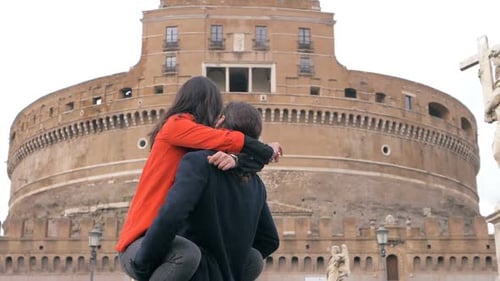 Romantic Couple Embrace in Front of Castel Sant'Angelo