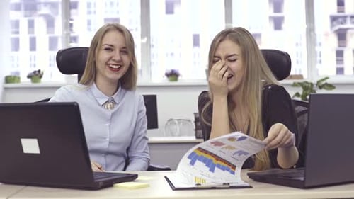 Women Collaborating on a Project in Office Environment