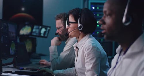 Diverse Team of Dispatchers Working in Mission Control Center