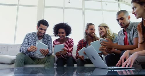 Executives using digital tablet and laptop 4k