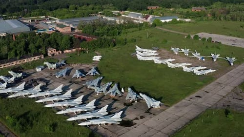 Top view of the planes at the airfield. Many old, broken aircraft are at the airfield.