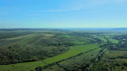 Drone Aerial View of Autumn Fields with Countryside Farmland Huts Around the Little Village