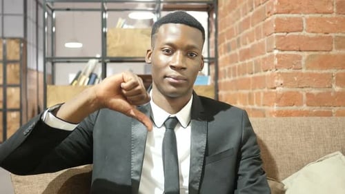 Thumbs Down By Black Businessman