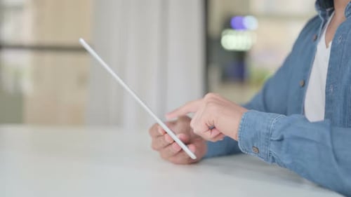 Close Up of Hand Using Digital Tablet