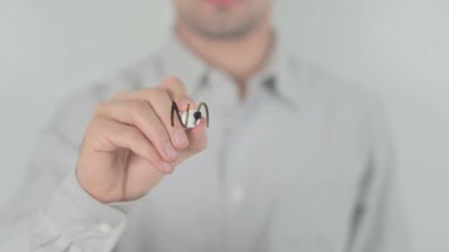 Writing National Debt with Marker on Clear Surface
