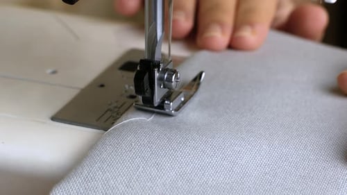 Sewing Machine Stitching Fabric in Detailed Close Up