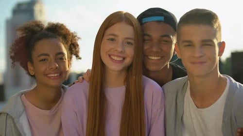 Smiling Teens Posing Together in an Urban Setting