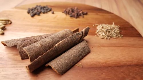 Spices and Herbs on Spoon on Table Top View