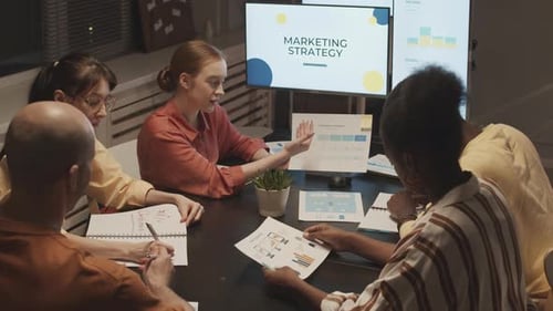 Marketing Specialists Having Office Meeting at Night
