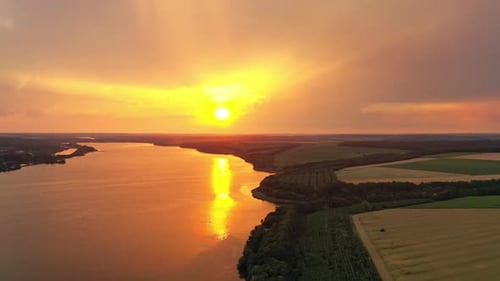 Aerial View of Lake and Fields at Sunset