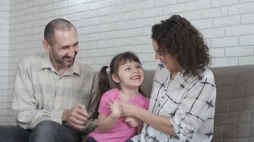 Happy family are playing together.