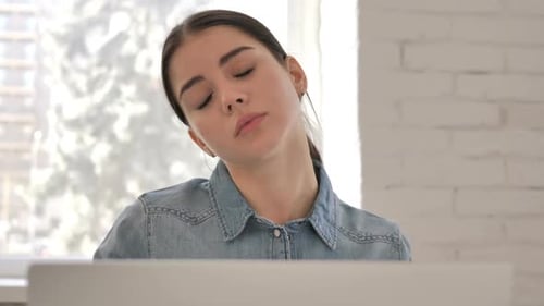 Close Up of Tired Young Girl with Neck Pain at Work