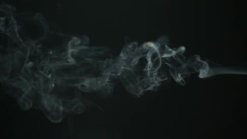 White Smoke Drifting on Black Background