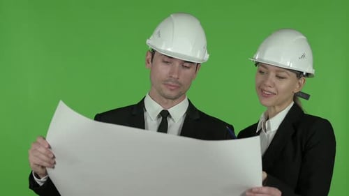 Satisfied Male Engineer Explaining Construction Blueprint To Female Engineer, Chroma Key
