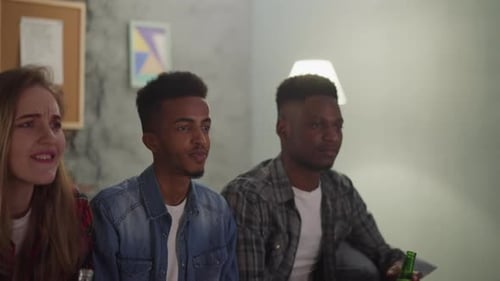 Friends Watching TV in a Home Setting
