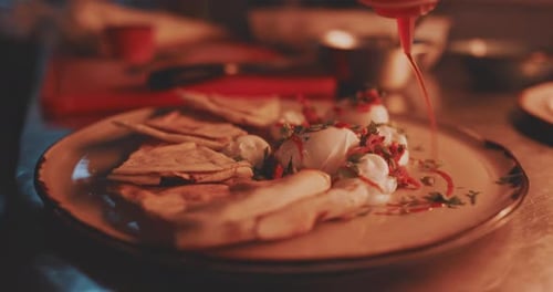 Close up of the chefs pouring the fresh sauce