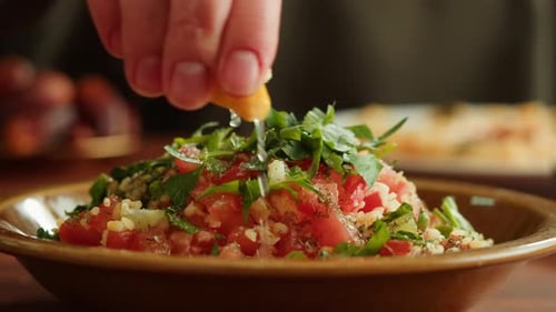 Lemon Juice Drizzled on Fresh Mediterranean Salad