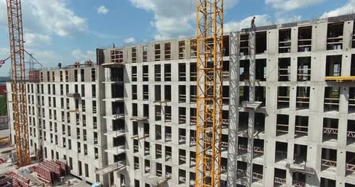 Aerial View of Unfinished Residential Complex with Builders Working
