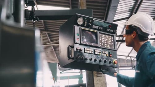 Smart Factory Worker Using Machine in Factory Workshop