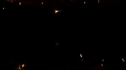 Funkelnde Spritzer bengalischer Feuer auf schwarzem Hintergrund