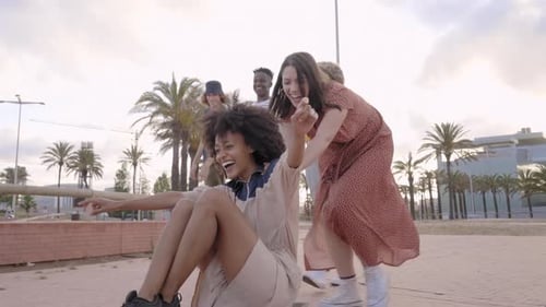 Group of Young People Having Fun with Skateboard in the City