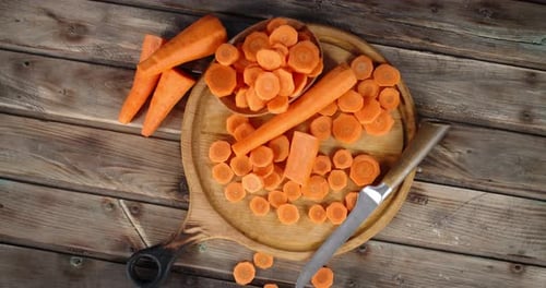 Overhead Shot of Carrots and Slices on Board