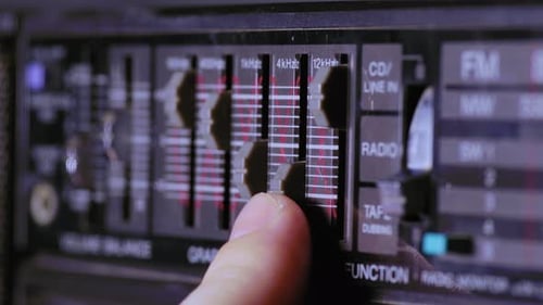 Adjusting Graphic Equalizer on Vintage Stereo System