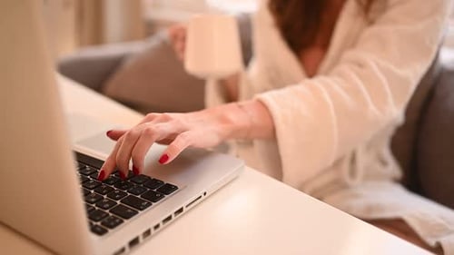 Technology Concept Close Up Young Woman Hands Working Online with Laptop Computer in White Bathrobe