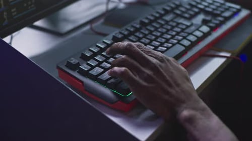 Hand Types on Glowing Computer Keyboard in the Dark