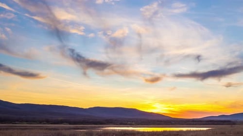 View of the Sunset Sky with Clouds Over the Balkan Mountains and the Black Sea Bay Near the Beach