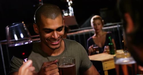 Friends Drinking Wine and Beer at Outdoor Bar