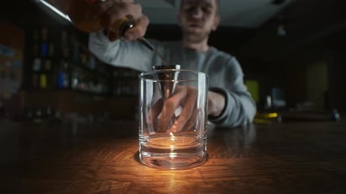 Wide Angle Macro Video of Pouring Whiskey To the Glass in Slowmotion, Pouring Alcohol in a Bar