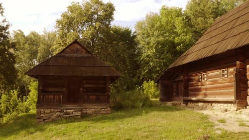 Rustic Log Cabins in Verdant Rural Landscape