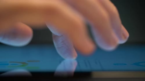 Close Up of Hand Using Computer Touch Screen