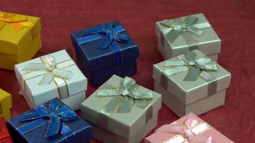 Colorful Gift Boxes Piled on a Red Background