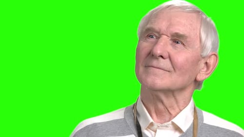 Senior Man Looking Upwards on Green Screen