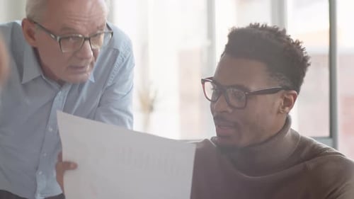 Sales Team Discussing Chart with Poor Results at Business Meeting