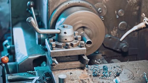 Metal Lathe Shaping Steel in Factory, Close Up