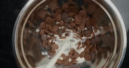 Milk Poured into Bowl of Chocolate Chips