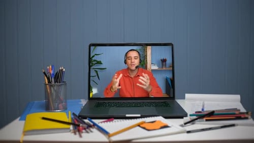 Man Talking on Laptop Screen During Video Call