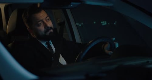Tired Man Driving at Night